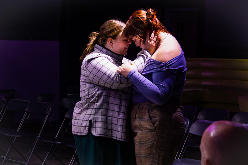 Two women embracing during a play at Three Witches Shakespeare in Louisville Kentucky