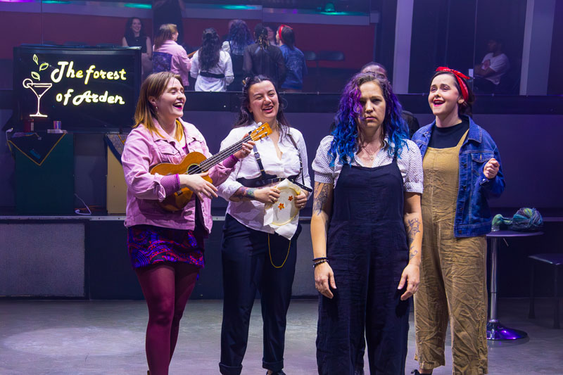Group singing during As You Like It production at Play bar with 3 Witches Shakespeare in Louisville Kentucky