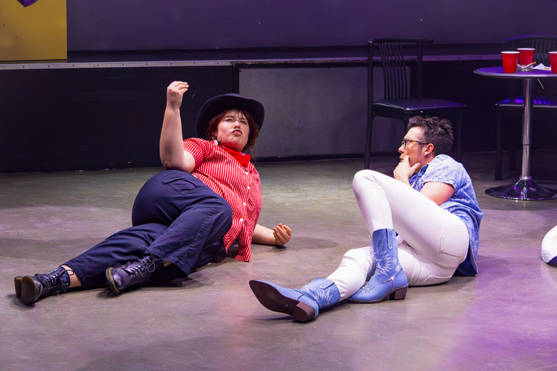 Performers lying on the ground on stage during production at Play bar with 3 Witches Shakespeare in Louisville Kentucky