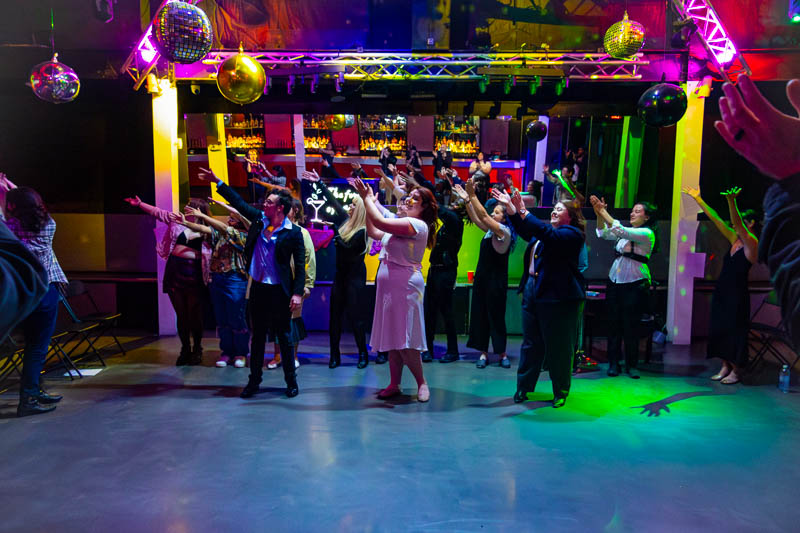 Group dancing in a nightclub scene during As You Like It with 3 Witches Shakespeare in Louisville Kentucky